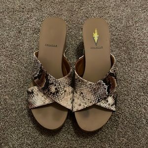 Woman’s size 6 snake skinned volatile wedges